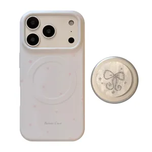 Witte iPhone hoes met roze sterrenpatroon en glitter strik magnetische grip houder