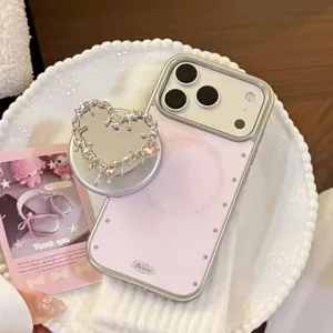 Détail du support miroir en forme de cœur argenté avec gemmes roses pour iPhone