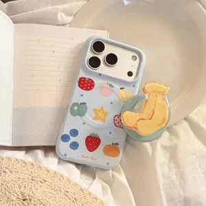 Detailed view of light blue iPhone case with cute fruit patterns and matching pop socket