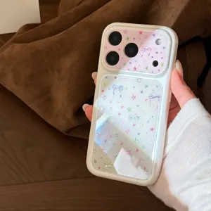 Close-up of a white iPhone case featuring iridescent starry patterns and dainty bow designs.