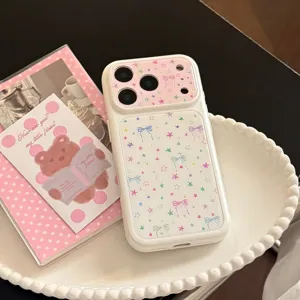 Cute white iPhone case featuring colorful stars and bows pattern detail view