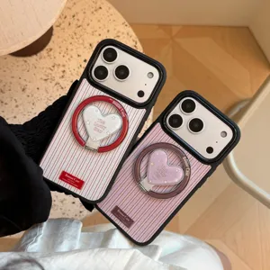 Close-up of vintage striped iPhone cases featuring built-in heart-shaped ring stands