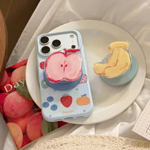 Detail shot of light blue fruit doodle phone case with matching apple Griptok accessory