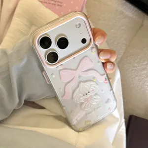 Close-up of transparent iPhone case with glitter and cute cream puppy bow design