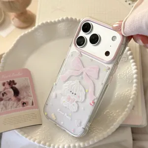 Macro detail of transparent iPhone case featuring Cream Puppy and pink bow design
