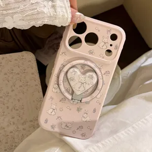 Detailed view of pink iPhone case featuring cartoon rabbit patterns and heart magnetic ring.