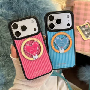 Close-up of striped iPhone cases with heart-shaped magnetic ring holders in pink and blue