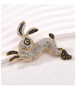 Macro view showing the intricate clear and black rhinestone details on a leaping rabbit brooch
