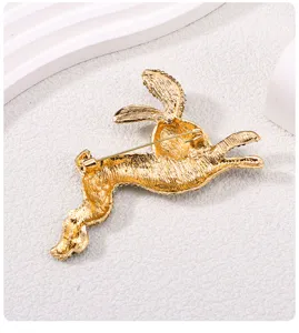Detailed back view of gold-colored rabbit brooch with secure pin clasp mechanism