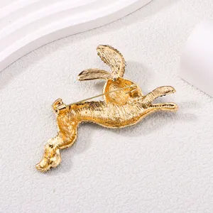 Detailed back view of a gold-plated leaping rabbit brooch with rhinestone accents