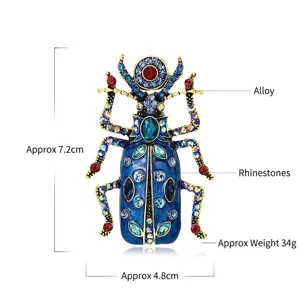 Vintage keverbroche met kleurrijke strass-steentjes en luxe blauw emaille finish