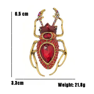 Macro view of vintage punk style beetle insect brooch with red rhinestones and 21.8g weight