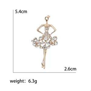 Elegante spilla a ballerina in strass dorati con indicazioni di dimensioni e peso