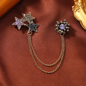 Vintage star and sunburst rhinestone brooch set with double golden tassel chains