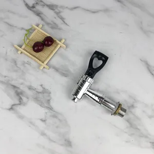 Beverage dispenser faucet replacement part with black heart handle for commercial water buckets.