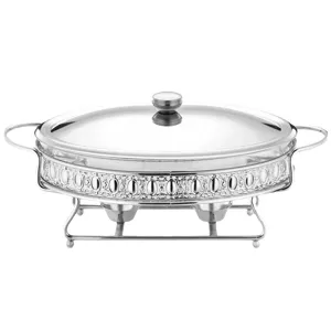 Elegant oval stainless steel buffet chafing dish with glass lid and fuel holders for catering.