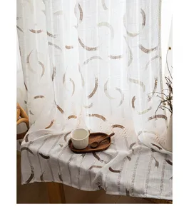 Detail view of wabi-sabi sheer curtain with hollow texture and curved print pattern.