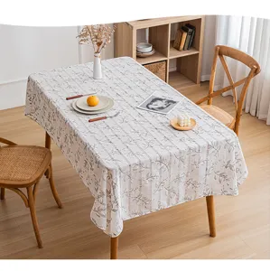Close-up detail of hollow-out stripe and floral print on soft rectangular tablecloth