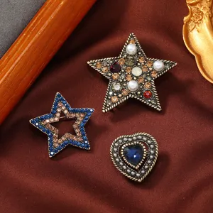 Vintage style three-piece brooch set with rhinestones and heart-shaped blue gem