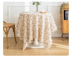 Pastoral French floral tablecloth with elegant tassels displayed on a round table.