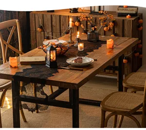 Elegant black lace Halloween table runner with spider web design in a cozy dining setting.