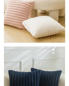 Close-up of soft ribbed rabbit fur plush pillow covers in pink and white colors