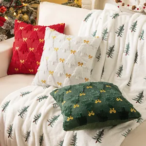 Cozy Christmas plush pillow covers with embroidered trees and bows for sofa decor.
