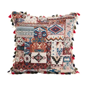 Bohemian ethnic style patchwork cushion cover with colorful tassels on white background