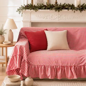 Close-up of the elegant ruffled hem and red gingham pattern on the soft sofa cover