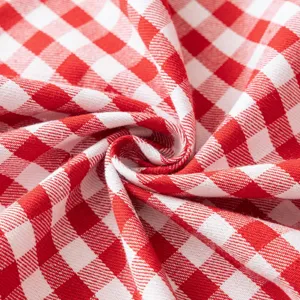 Detailed close-up showing the soft texture of red and white gingham checkered sofa cover fabric