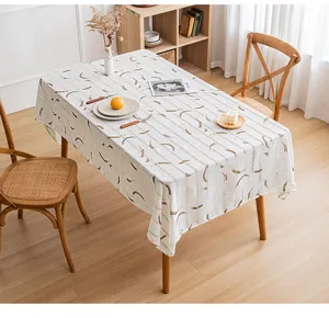 Rectangular tablecloth featuring hollowed stripes and artistic prints in a warm dining room