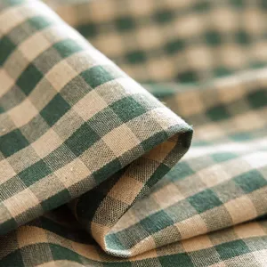 Green and beige checkered tablecloth with ruffled edges in a minimalist ins style