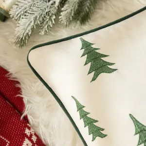 Embroidered Christmas tree pillow cover with green chenille piping on soft cream fabric