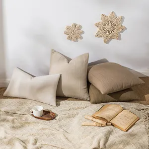 Minimalist cream and brown linen cushion covers with subtle striped texture for sofa