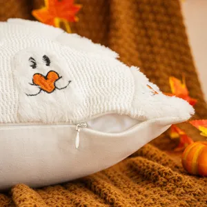 Cozy Halloween white plush ghost cushion with orange heart embroidery and zipper detail