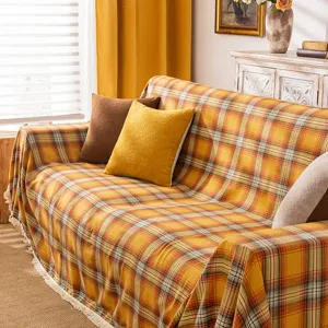 Copridivano a quadri arancioni con frange e nappe per arredamento vintage casa