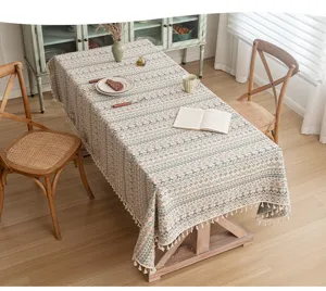 A close-up view of the bohemian geometric jacquard tablecloth with tassel fringe