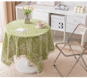 Green botanical leaf pattern tablecloth with decorative tassel fringe detail