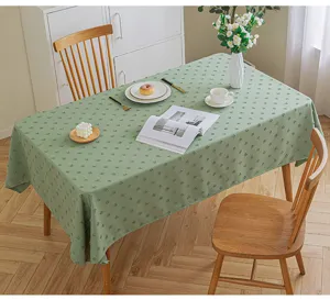 Detailed view of a green rectangular waterproof tablecloth with 3D geometric floral patterns