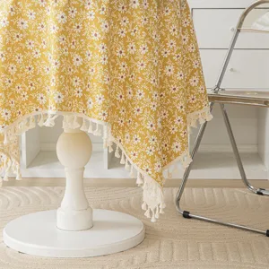 Yellow floral tablecloth with elegant fringe tassels for dining or coffee table decor