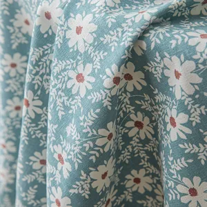 Rustic teal floral tablecloth with white daisy print for dining and coffee tables