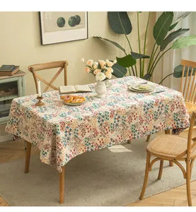 Detailed view of American style floral jacquard tablecloth on a wooden dining table setup