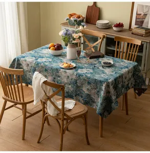 Moroccan style blue floral jacquard tablecloth on a wooden dining table in a cozy room