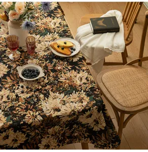 Detailed view of vintage American floral jacquard tablecloth on a dining table setup