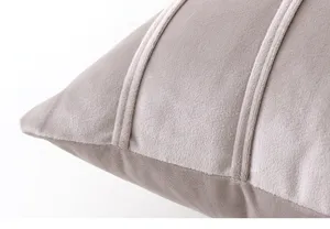 Detail shot of grey velvet cushion cover with elegant vertical strap design texture