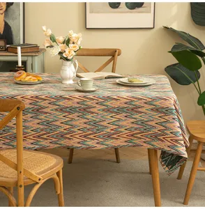 Detail view of American style geometric patterned jacquard tablecloth on a dining table.