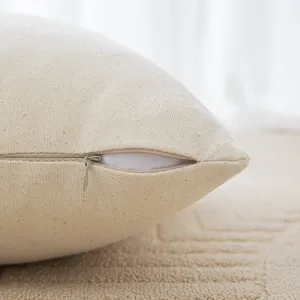 Beige textured cotton canvas cushion cover featuring a smooth invisible zipper detail