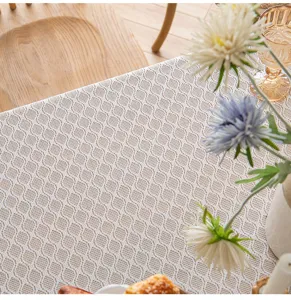 Detail view showing the intricate honeycomb mesh pattern of the French lace tablecloth.