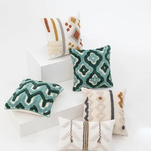 Bohemian tufted cushion covers with Moroccan geometric patterns on white cubes