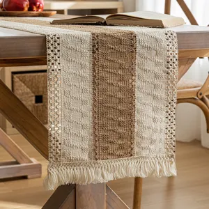 Hand-woven Bohemian cotton linen table runner featuring hollow patterns and fringe tassels